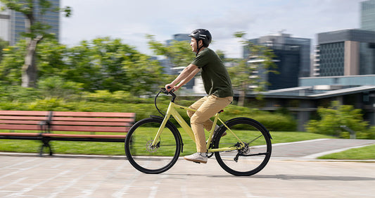 E-bike rider commuting through a busy city during World Cup 2026 traffic and events.