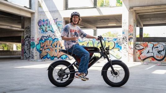 A man rides through the city on the moped style ebike that suits him best.