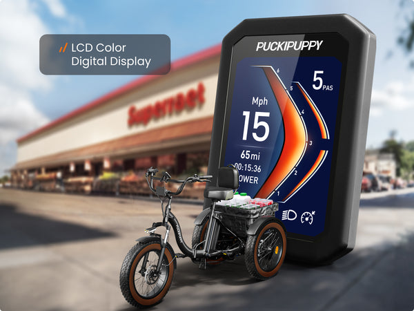 Alaskan Black Long Battery Life Edition electric cargo trike with an LCD color display showing speed, range, and pedal-assist level.