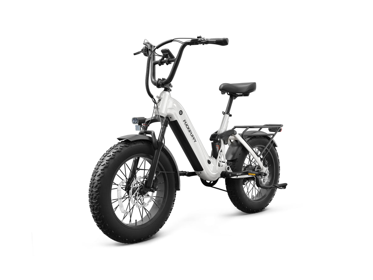 White PUCKIPUPPY Corgi fat tire electric bike with a step-through frame, front suspension, rear rack, full fenders, and integrated headlight.