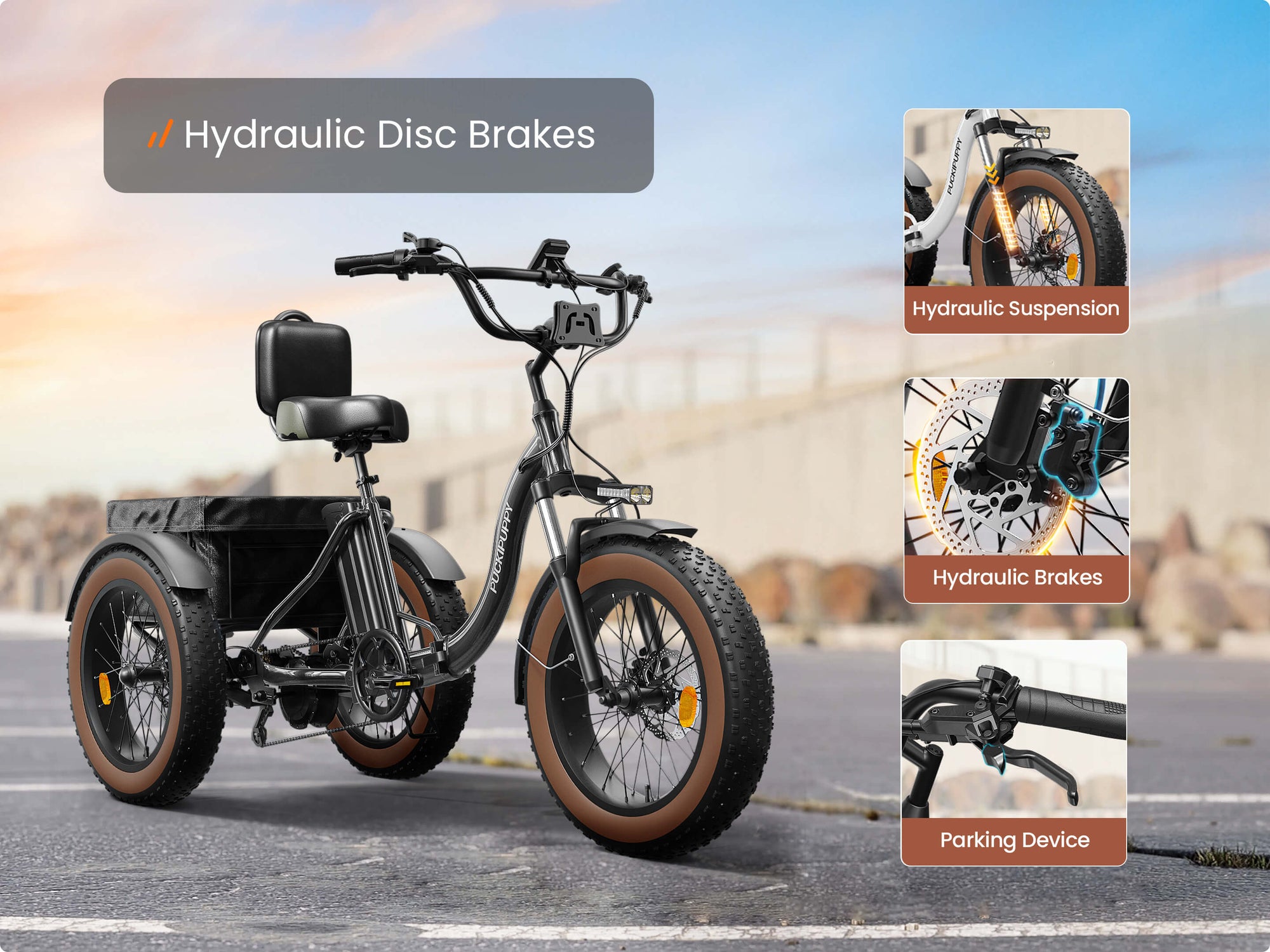 Black Alaskan electric cargo trike with hydraulic disc brakes, front hydraulic suspension, a parking brake, fat tires, and a rear basket.