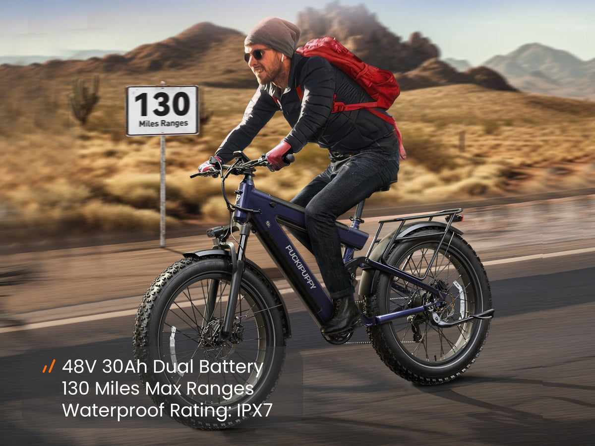 Rider using a PUCKIPUPPY Bulldog Pro fat tire electric bike with a 48V 30Ah dual battery, up to 130-mile range, and IPX7 waterproof rating.