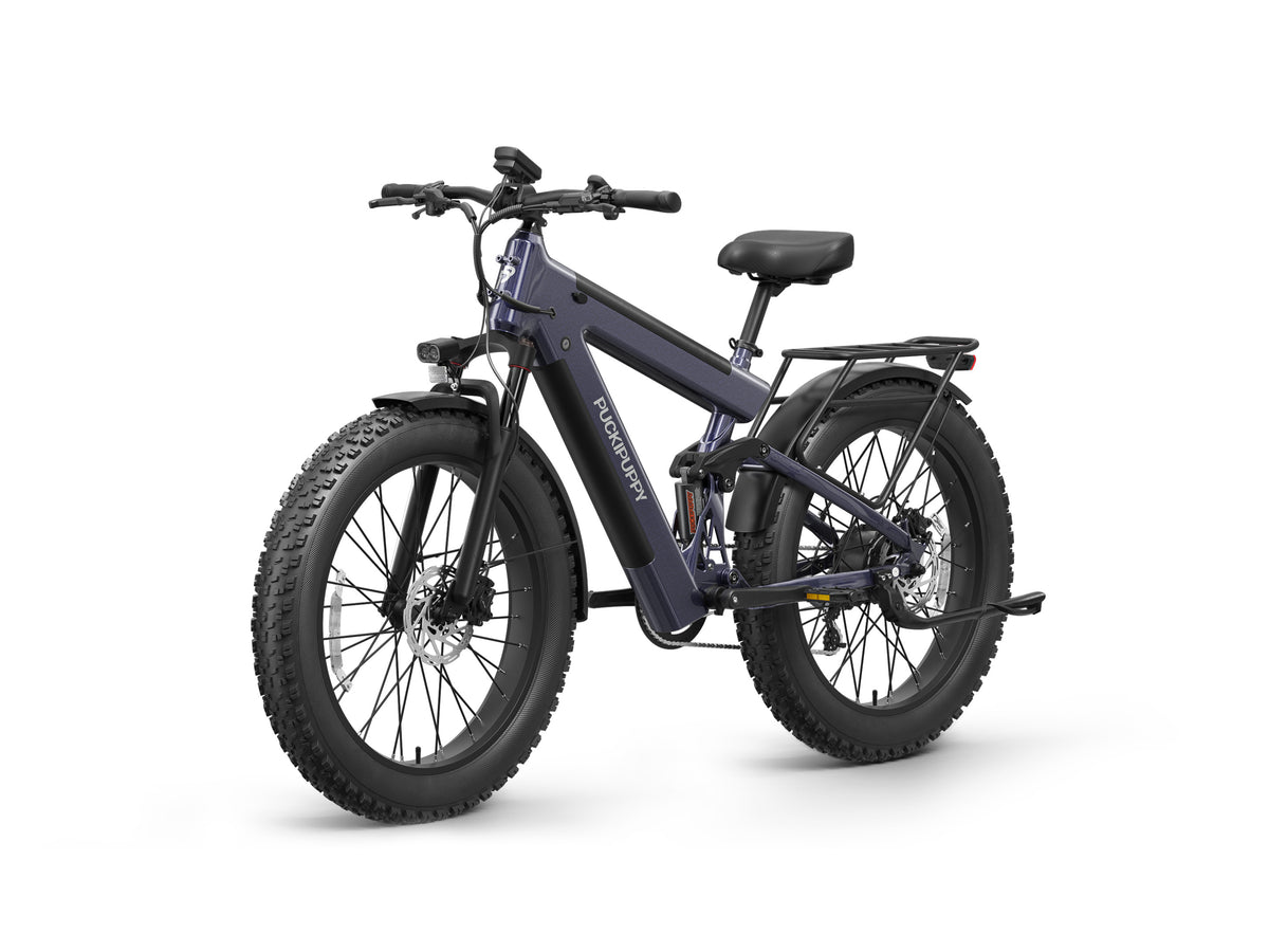 PUCKIPUPPY Bulldog Pro fat tire electric bike with full suspension, dual batteries, rear cargo rack, full fenders, and integrated front light.